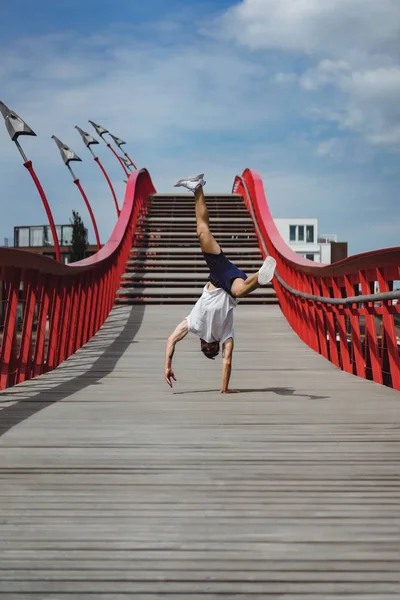 man on the bridge in amsterdam, python bridge