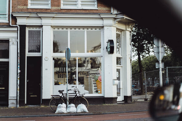 cozy courtyards of Amsterdam, benches, bicycles, flowers in tubs.  streets of Amsterdam