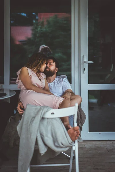 Young couple in love on the terrace of their home. — Stock Photo, Image