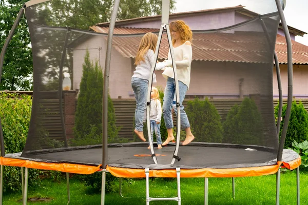 Mother Her Children Daughters Jumping Trampoline — Stock Photo, Image