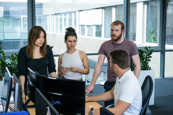 Team job. Photo young businessmans crew working with new startup project in modern loft.