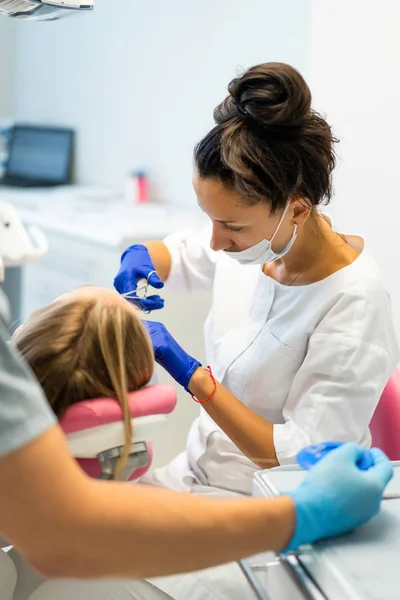 Dentist in the process. Dental services, dental office, dental t — Stock Photo, Image