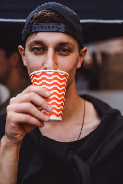 Man Drinks Cardboard Glass — 스톡 사진