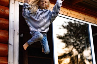 girl jumping and having fun. Happy childhood, games, fun.