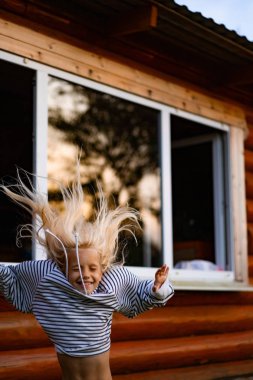 girl jumping and having fun. Happy childhood, games, fun.