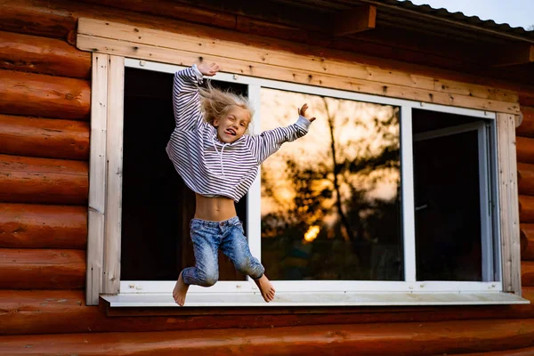 girl jumping and having fun. Happy childhood, games, fun.