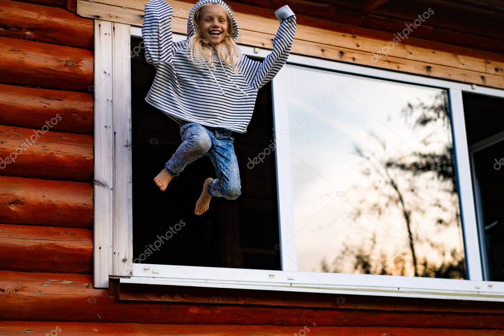 girl jumping and having fun. Happy childhood, games, fun.