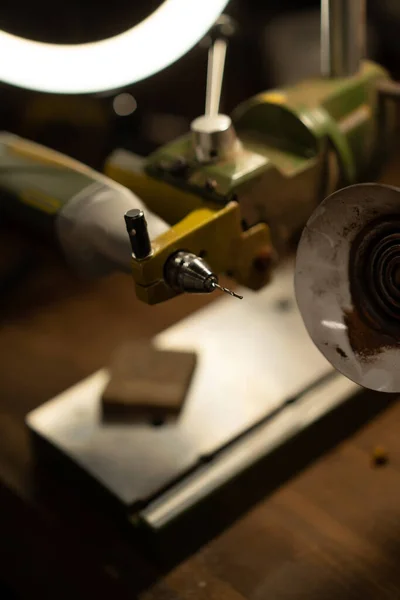 Workshop on wood and stone, machines for working with wood, manual work, the creation process. Hands work with a wood, close-up.