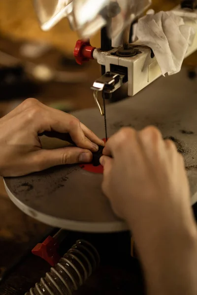 Workshop on wood and stone, machines for working with wood, manual work, the creation process. Hands work with a wood, close-up.