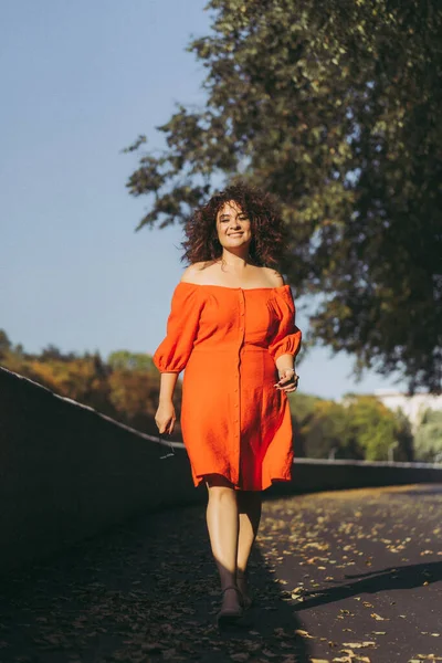 Beautiful Woman Curly Dark Hair Red Dress Walks Autumn City — Stock Photo, Image