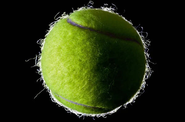 Tennis boll på svart bakgrund — Stockfoto