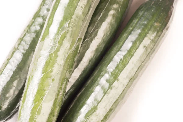 Bunch of cucumber wrapped in plastic films — Stock Photo, Image