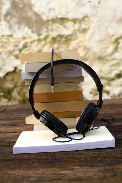 Pile of books and audio headset