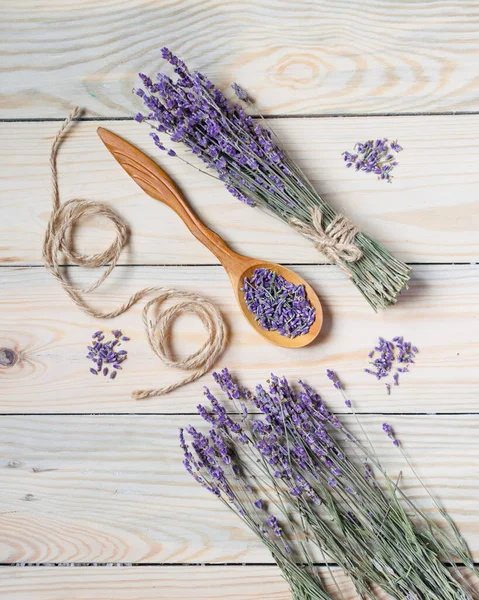 Bunch of dried lavender on wooden background. Top view.