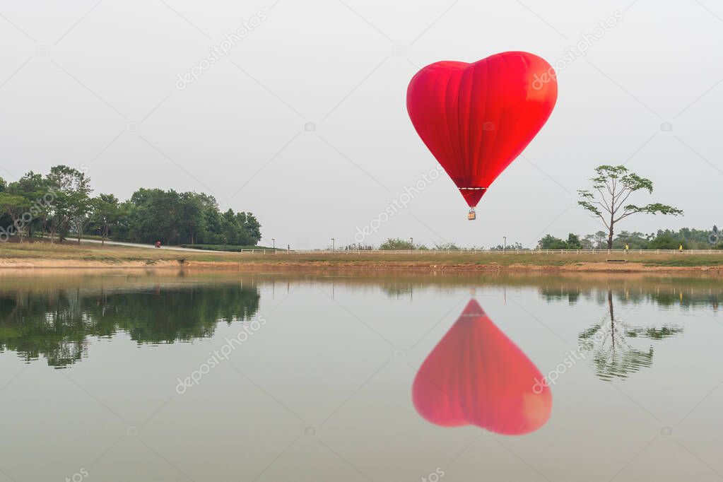 color hot air balloon over the lake water