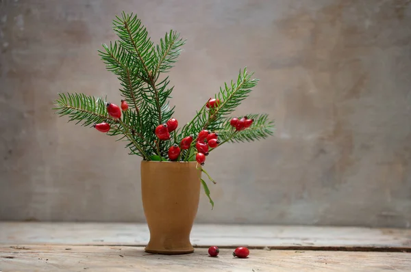 Natural Christmas Decoration Rose Hips Fir Branches Stoneware Vase Rustic — Stock Photo, Image