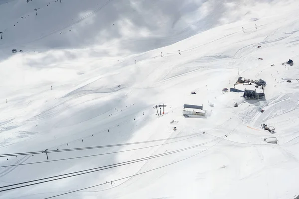 ski area in the snow on the zugspitze glacier with lift, cable car and slopes in the alps between germany and austria near garmisch patenkirchen, copy space