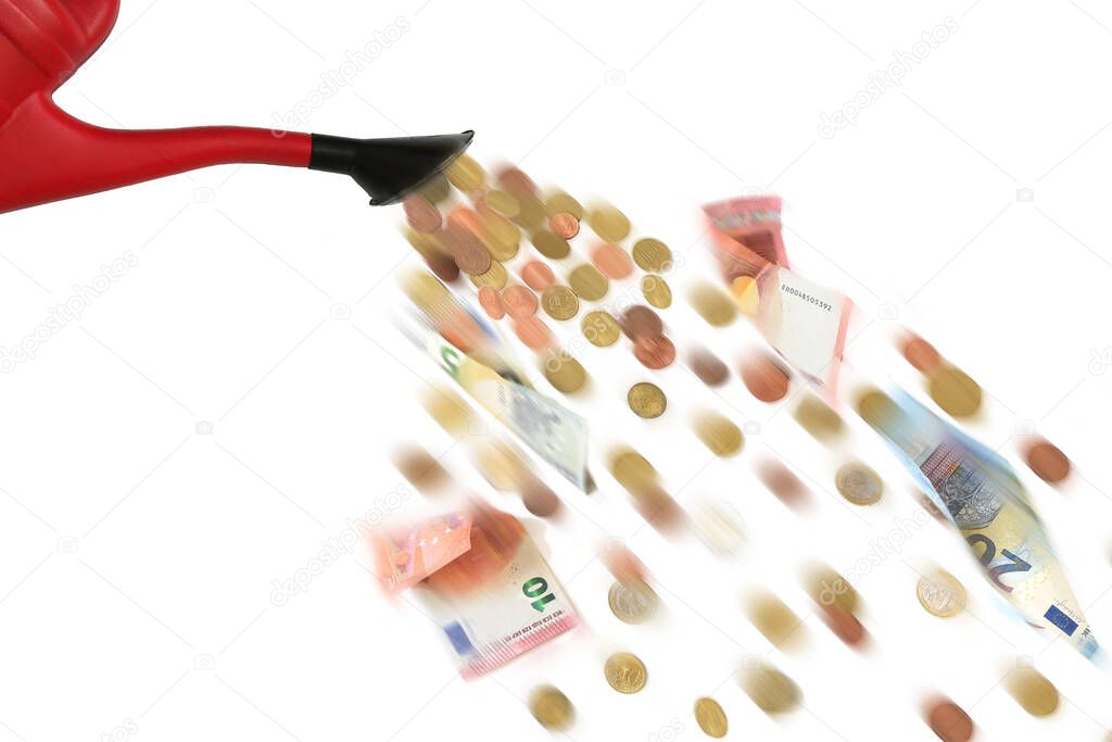 Red watering can is pouring Euro coins and banknotes, dumping money at random or spreading subsidies and grants too thinly is called watering can principle, motion blur, isolated on a white background, copy space