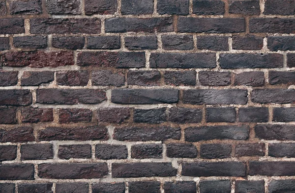 Close up dark brick old textured wall background — Stock Photo, Image