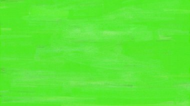 Dikkatsizce boyanmış bir duvarın dokusu açık yeşil renklerde..