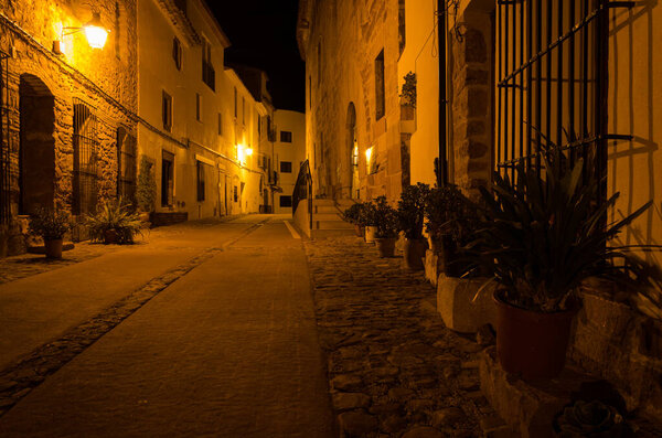 Street of Villafames illuminated at night, Castellon, Spain