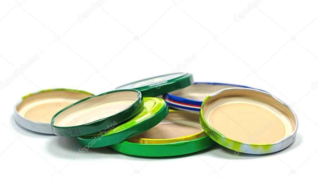 Old canning lids against white background