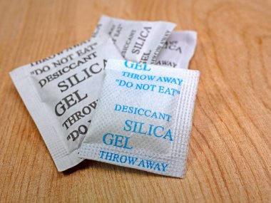 Silica gel as a granulate in a paper bag clipart