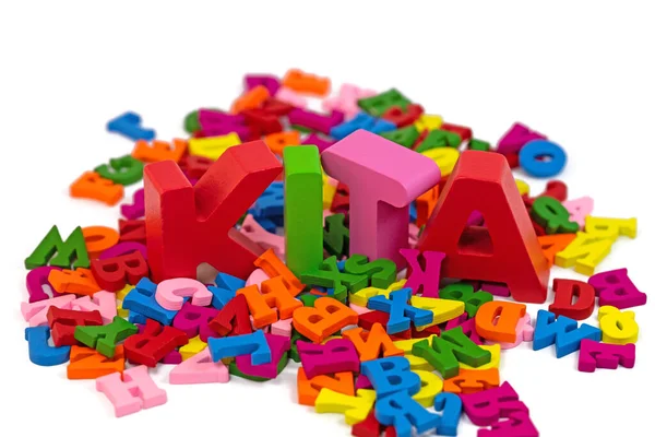 Colorful wooden letters with the german text KITA, day care center
