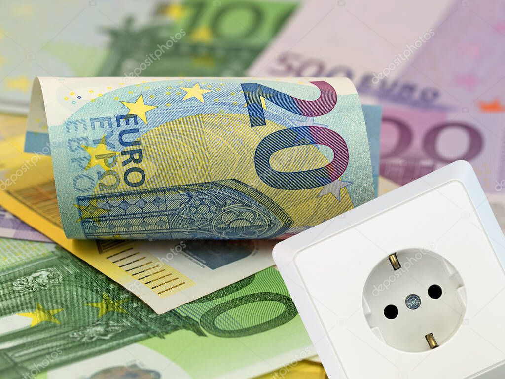 Banknotes and socket symbolic of electricity price