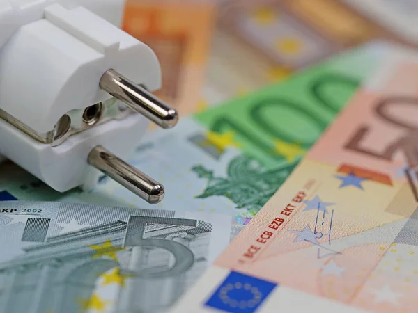 Energy bill with banknotes and power plug