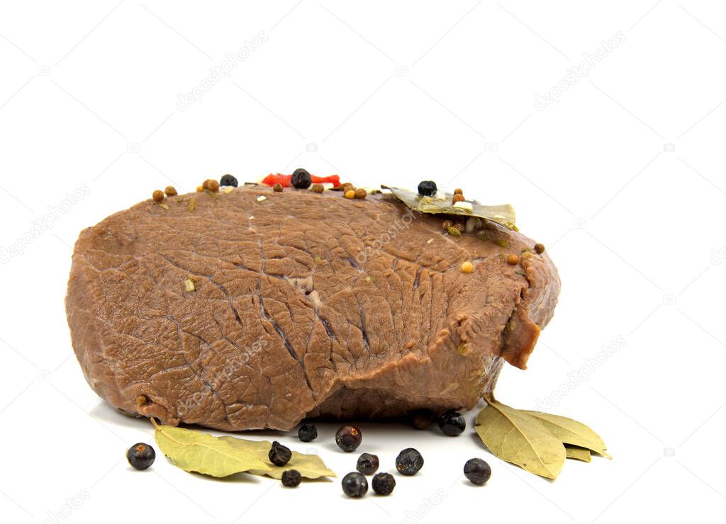 Beef roast marinated with spices against white background