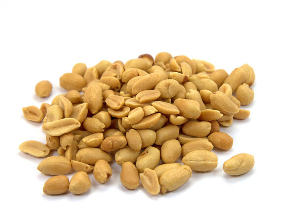 Roasted and salted peanuts against a white background