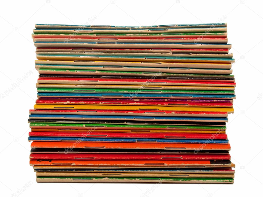 A stack of dimes novels isolated against a white background