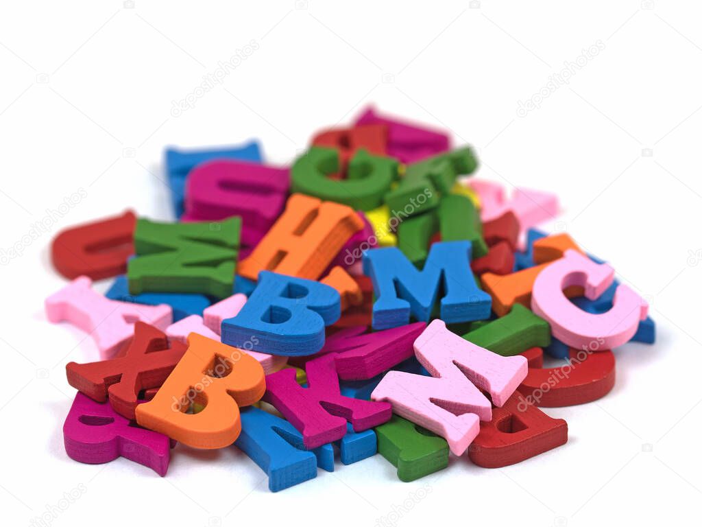 Colorful wooden letters against white background