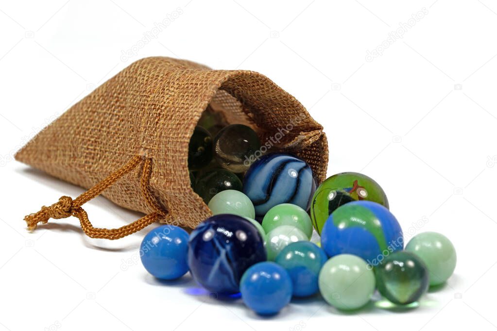 Colorful glass balls in a jute bag