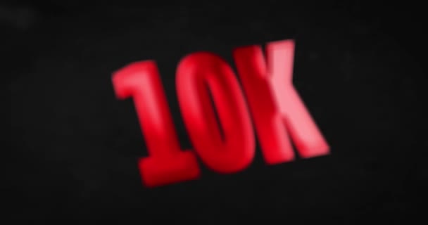10K, 10000. Glanzend rood woord animatie — Stockvideo