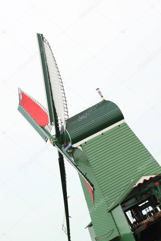 Isolated image of a traditional historic windmill (wind turbine), an iconic landmark in the Netherlands (Picture was taken in The Hague).