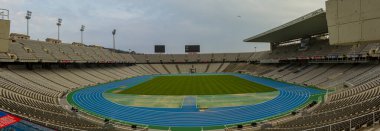 Barcelona, Spain 05/02/2010: Panorama of Estadi Olimpic Lluis Companys, the stadium used during 1992 Barcelona Summer olympic games. Image features the blue track with lanes and the field clipart