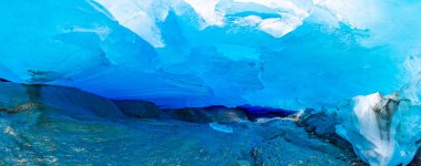 Blue ice cave of Svartisen Glacier, Norway clipart