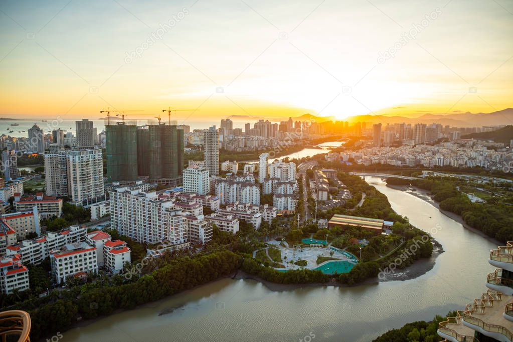 Aerial view of Sanya city with river at sunset light, Hainan province, China