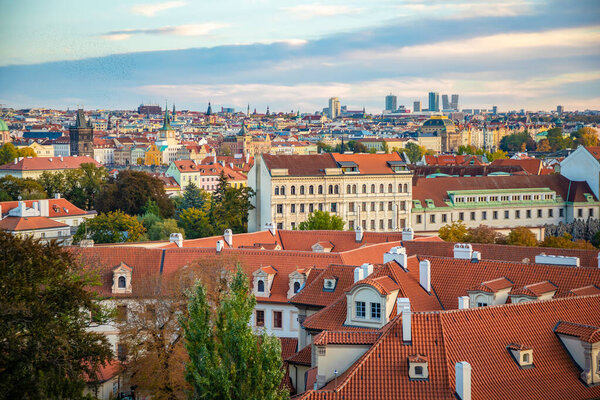 Aerial view of Prague city with red roofs and cathedral in sunset time in Prague, Czech Republic