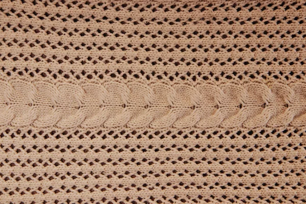La textura de una bufanda de punto en beige. Hermoso fondo —  Fotos de Stock