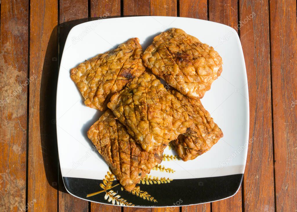Fried tempeh. Tempeh is a traditional soy product originating from Indonesia.