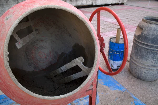 concrete mixer with cement in interior patio