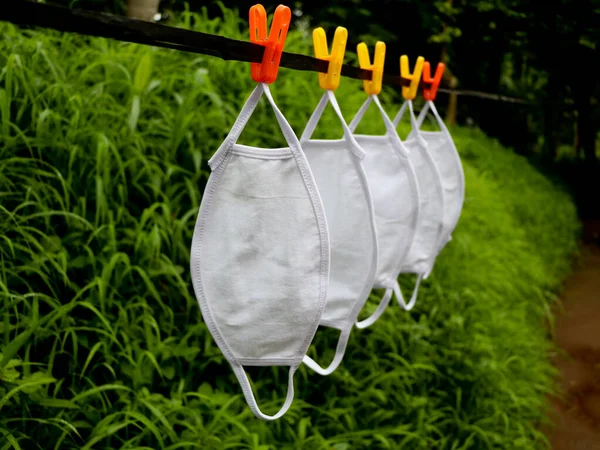 White Color Reusable Mask Hung Drying Washing Green Background Corona — Stock Photo, Image