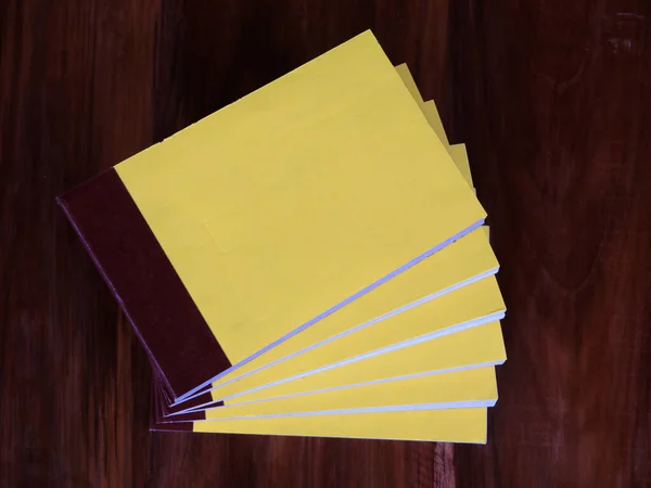 Yellow Color Bill Books Receipt Books Wooden Surface Close Shot — Stock Photo, Image