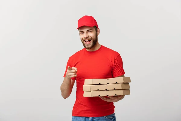 Leverans koncept: Porträtt av Pizza leverans man presentera något i rutan. Isolerade vit bakgrund. — Stockfoto