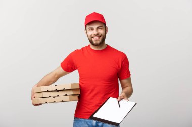 Teslim kavramı: genç yakışıklı teslimat adam ile bir belge veren pizza kutuları imzalamak için