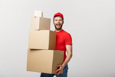 Delivery Concept: Man hardly carries the cardboard boxes, isolated on white background. Concept of difficult career of a delivery man clipart
