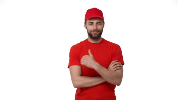 Handsome male service industry worker deliveryman in uniform posing on white background with arms crossed confidence professionalism career employment concept. — Stock Video